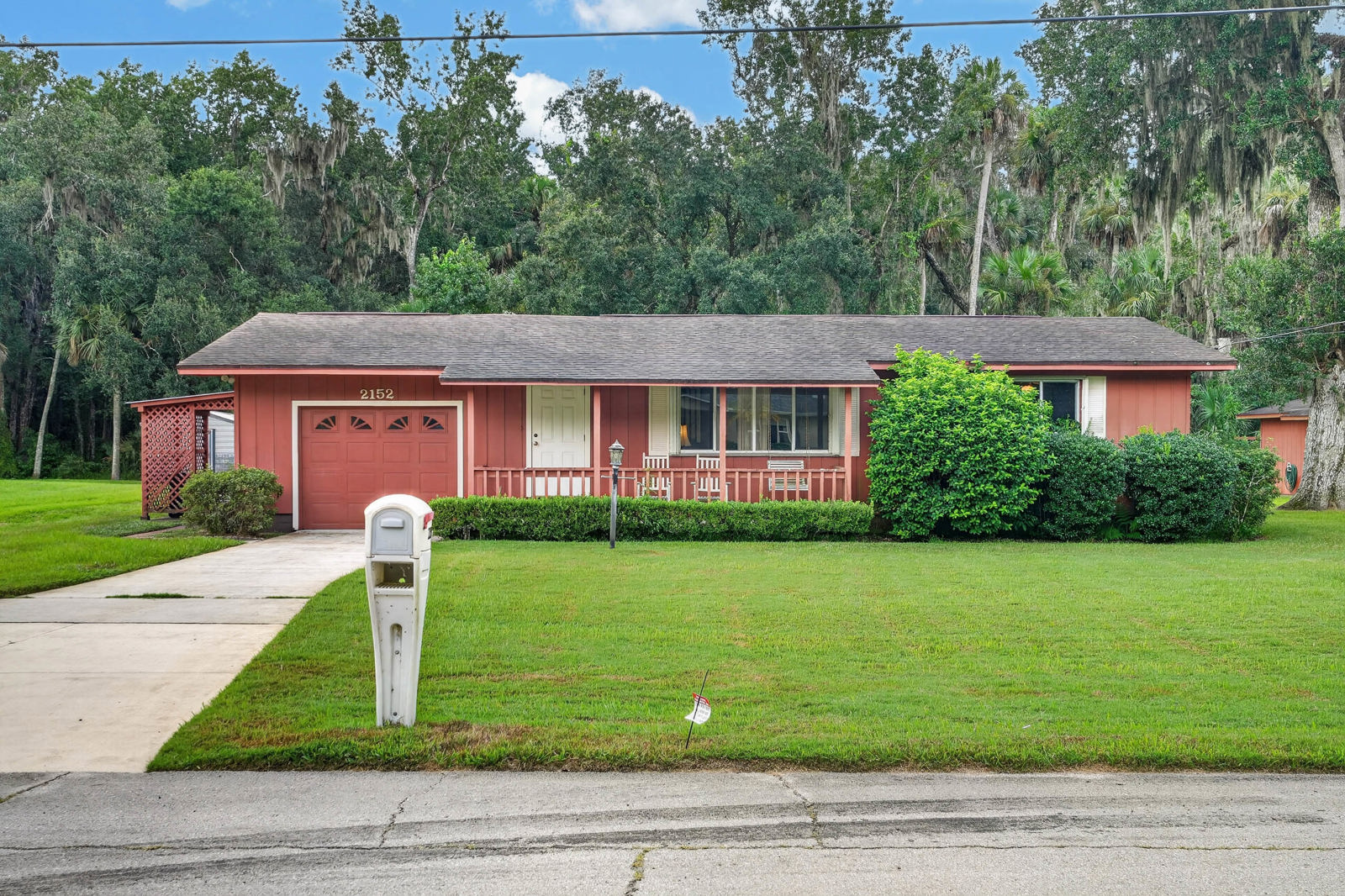 Front exterior with covered porch and attached garage